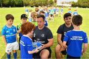 24 July 2019; Leinster players Bryan Byrne, left, and Jimmy O’Brien sign jerseys for participants during the Bank of Ireland Leinster Rugby Summer Camp in St Marys College RFC in Templeogue, Dublin. Photo by Seb Daly/Sportsfile