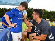 24 July 2019; Leinster's Jimmy O’Brien signs a participant's jersey during the Bank of Ireland Leinster Rugby Summer Camp in St Marys College RFC in Templeogue, Dublin. Photo by Seb Daly/Sportsfile