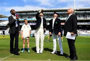 24 July 2019; England captain Joe Root tosses the coin, watched by William Porterfield, his Ireland counterpart, match referee Andy Pycroft, right, and Michael Holding, Sky TV, left, during day one of the Specsavers Test Match between Ireland and England at Lords Cricket Ground in London, England. Photo by Matt Impey/Sportsfile