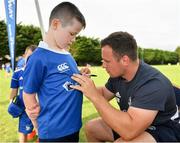 24 July 2019; Leinster's Bryan Byrne signs a participant's jersey during the Bank of Ireland Leinster Rugby Summer Camp in St Marys College RFC in Templeogue, Dublin. Photo by Seb Daly/Sportsfile