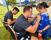24 July 2019; Leinster's Bryan Byrne signs a participant's jersey during the Bank of Ireland Leinster Rugby Summer Camp in St Marys College RFC in Templeogue, Dublin. Photo by Seb Daly/Sportsfile