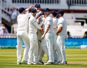 24 July 2019; Ireland players congratulate Tim Murtagh after he had taken the wicket of Chris Woakes of England during day one of the Specsavers Test Match between Ireland and England at Lords Cricket Ground in London, England. Photo by Matt Impey/Sportsfile
