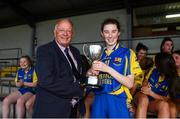 24 July 2019; Lauren McGuire of Longford receives the trophy from Pat Quill, LGFA, following the All-Ireland U16 ‘B’ Championship Final 2019 match between Longford and Waterford at St Brendans Park in Birr, Co Offaly. Photo by David Fitzgerald/Sportsfile