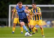 26 July 2019; Cory Galvin of Waterford in action against Jack Keaney of UCD during the SSE Airtricity League Premier Division match between UCD and Waterford at UCD Bowl in Belfield, Dublin. Photo by Ben McShane/Sportsfile