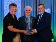 26 July 2019; Brother Bernard Twomey, is presented with the Jeremy Dee Services to Women's Football award by FAI Board Member Niamh O'Donoghue, Chairperson of the Women's Football Committee, and FAI President Donal Conway during the FAI Delegates Dinner and Communications Awards at Knightsbrook Hotel in Trim, Meath. Photo by Seb Daly/Sportsfile
