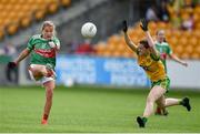 27 July 2019; Sarah Rowe of Mayo kicks a point despite the attention of Niamh Carr of Donegal during the TG4 All-Ireland Ladies Football Senior Championship Group 4 Round 3 match between Donegal and Mayo at Bord Na Mona O'Connor Park in Tullamore, Offaly. Photo by Ben McShane/Sportsfile