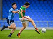 27 July 2019; Rory Morrin of Mayo shoots to score his side's fifth goal of the game, despite presure from Oran Farrell of Dublin, during the Electric Ireland GAA Football All-Ireland Minor Championship Quarter-Final match between Mayo and Dublin at Glennon Brothers Pearse Park in Longford. Photo by Seb Daly/Sportsfile