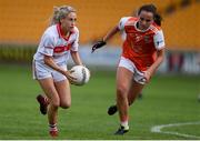 27 July 2019; Orla Finn of Cork in action against Megan Sheridan of Armagh during the TG4 All-Ireland Ladies Football Senior Championship Group 1 Round 3 match between Armagh and Cork at Bord Na Mona O'Connor Park in Tullamore, Offaly. Photo by Ben McShane/Sportsfile