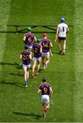 28 July 2019; The Wexford players make their way to the team photo ahead of the GAA Hurling All-Ireland Senior Championship Semi Final match between Wexford and Tipperary at Croke Park in Dublin. Photo by Daire Brennan/Sportsfile