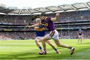 28 July 2019; Diarmuid O'Keeffe of Wexford in action against Brendan Maher of Tipperary during the GAA Hurling All-Ireland Senior Championship Semi Final match between Wexford and Tipperary at Croke Park in Dublin. Photo by Ramsey Cardy/Sportsfile
