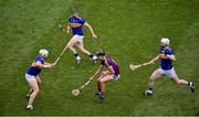 28 July 2019; Jack O'Connor of Wexford in action against Tipperary players, left to right, Padraic Maher, Dan McCormack, Michael Breen, during the GAA Hurling All-Ireland Senior Championship Semi Final match between Wexford and Tipperary at Croke Park in Dublin. Photo by Daire Brennan/Sportsfile