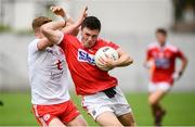 28 July 2019; Mark Cronin of Cork in action against Peadar Mullan of Tyrone during the EirGrid GAA Football All-Ireland U20 Championship Semi-Final match between Cork and Tyrone at Bord Na Mona O'Connor Park in Tullamore, Offaly. Photo by David Fitzgerald/Sportsfile