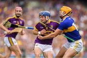 28 July 2019; Kevin Foley of Wexford is tackled by Séamus Callanan of Tipperary during the GAA Hurling All-Ireland Senior Championship Semi Final match between Wexford and Tipperary at Croke Park in Dublin. Photo by Ramsey Cardy/Sportsfile