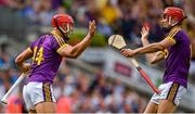 28 July 2019; Lee Chin of Wexford celebrates with team-mate Paul Morris after scoring their side's second goal during the GAA Hurling All-Ireland Senior Championship Semi Final match between Wexford and Tipperary at Croke Park in Dublin. Photo by Brendan Moran/Sportsfile