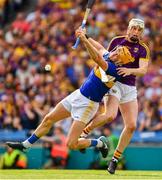 28 July 2019; Seamus Callanan of Tipperary is fouled by Wexford full back Liam Ryan during the GAA Hurling All-Ireland Senior Championship Semi Final match between Wexford and Tipperary at Croke Park in Dublin. Photo by Ray McManus/Sportsfile