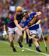 28 July 2019; Willie Connors of Tipperary in action against Simon Donohoe of Wexford during the GAA Hurling All-Ireland Senior Championship Semi Final match between Wexford and Tipperary at Croke Park in Dublin. Photo by Ramsey Cardy/Sportsfile