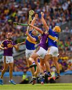 28 July 2019; Ronan Maher of Tipperary wins possession ahead of his team mate Padraic Maher and Conor McDonald of Wexford during the GAA Hurling All-Ireland Senior Championship Semi Final match between Wexford and Tipperary at Croke Park in Dublin. Photo by Ray McManus/Sportsfile