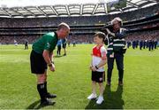 28 July 2019; NLI volunteer lifeboat crew from stations across Ireland unfurl giant water safety flags on the pitch of Croke Park before the All-Ireland Senior Hurling semi-final between Wexford and Tipperary.  The activity was part of the RNLI’s partnership with the GAA to prevent drownings and share water safety advice.  10 year old Cahir MCallion, from Omagh, Co. Tyrone, who was rescued from the sea at Bundoran last year presents the sliothar to referee Sean Cleere prior to the GAA All-Ireland Senior Hurling semi-final in Croke Park as part of the RNLI’s partnership with the GAA to prevent drownings and share water safety advice. Photo by Ramsey Cardy/Sportsfile