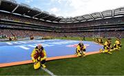 28 July 2019; RNLI volunteer lifeboat crew from stations across Ireland unfurl giant water safety flags on the pitch of Croke Park before the All-Ireland Senior Hurling semi-final match between Wexford and Tipperary at Croke Park in Dublin. The activity was part of the RNLI’s partnership with the GAA to prevent drownings and share water safety advice. Photo by Ramsey Cardy/Sportsfile