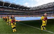 28 July 2019; RNLI volunteer lifeboat crew from stations across Ireland unfurl giant water safety flags on the pitch of Croke Park before the All-Ireland Senior Hurling semi-final match between Wexford and Tipperary at Croke Park in Dublin. The activity was part of the RNLI’s partnership with the GAA to prevent drownings and share water safety advice. Photo by Ramsey Cardy/Sportsfile