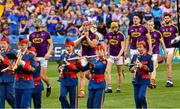 28 July 2019; Wexford joint captains, Matthew O'Hanlon, left, and Lee Chin, lead their players in the pre match parade before the GAA Hurling All-Ireland Senior Championship Semi Final match between Wexford and Tipperary at Croke Park in Dublin. Photo by Ray McManus/Sportsfile