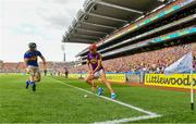 28 July 2019; Paul Morris of Wexford puts the sliotar through the legs of Cathal Barrett of Tipperary before going on to score a point during the GAA Hurling All-Ireland Senior Championship Semi Final match between Wexford and Tipperary at Croke Park in Dublin. Photo by Brendan Moran/Sportsfile