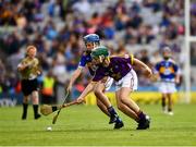 28 July 2019; Thomas O'Brien, Rathcormas NS, Rathcormac, Sligo, representing Tipperary, and James Cully, Kildalkey NS, Kildalkey, Meath, representing Wexford, during the INTO Cumann na mBunscol GAA Respect Exhibition Go Games at the GAA Hurling All-Ireland Senior Championship Semi Final match between Wexford and Tipperary at Croke Park in Dublin. Photo by Ray McManus/Sportsfile