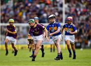 28 July 2019; James Cully, Kildalkey NS, Kildalkey, Meath, representing Wexford, is tackled by Harry Mac Canainn, Scoil na nÓg, Glanmire, Cork, representing Tipperary, during the INTO Cumann na mBunscol GAA Respect Exhibition Go Games at the GAA Hurling All-Ireland Senior Championship Semi Final match between Wexford and Tipperary at Croke Park in Dublin. Photo by Ray McManus/Sportsfile