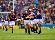 28 July 2019; James Cully, Kildalkey NS, Kildalkey, Meath, representing Wexford, is tackled by Harry Mac Canainn, Scoil na nÓg, Glanmire, Cork, representing Tipperary, during the INTO Cumann na mBunscol GAA Respect Exhibition Go Games at the GAA Hurling All-Ireland Senior Championship Semi Final match between Wexford and Tipperary at Croke Park in Dublin. Photo by Ray McManus/Sportsfile