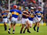28 July 2019; James Cully, Kildalkey NS, Kildalkey, Meath, representing Wexford, is tackled by Harry Mac Canainn, Scoil na nÓg, Glanmire, Cork, representing Tipperary, and left, Thomas Sheridan, Corballa NS, Corballa, Vi Ballina, Sligo, representing Tipperary, during the INTO Cumann na mBunscol GAA Respect Exhibition Go Games at the GAA Hurling All-Ireland Senior Championship Semi Final match between Wexford and Tipperary at Croke Park in Dublin. Photo by Ray McManus/Sportsfile