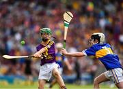 28 July 2019; Dan O'Connor, St Mary’s PS, Bellanaleck, Fermanagh, representing Wexford, and Harry Mac Canainn, Scoil na nÓg, Glanmire, Cork, representing Tipperary, during the INTO Cumann na mBunscol GAA Respect Exhibition Go Games at the GAA Hurling All-Ireland Senior Championship Semi Final match between Wexford and Tipperary at Croke Park in Dublin. Photo by Ray McManus/Sportsfile