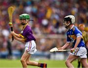 28 July 2019; Dan O'Connor, St Mary’s PS, Bellanaleck, Fermanagh, representing Wexford, and Harry Mac Canainn, Scoil na nÓg, Glanmire, Cork, representing Tipperary, during the INTO Cumann na mBunscol GAA Respect Exhibition Go Games at the GAA Hurling All-Ireland Senior Championship Semi Final match between Wexford and Tipperary at Croke Park in Dublin. Photo by Ray McManus/Sportsfile