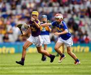 28 July 2019; Ciaran King, St Kevin’s NS, Dunleer, Louth, representing Wexford, and Thomas Sheridan, Corballa NS, Corballa, Vi Ballina, Sligo, representing Tipperary,  during the INTO Cumann na mBunscol GAA Respect Exhibition Go Games at the GAA Hurling All-Ireland Senior Championship Semi Final match between Wexford and Tipperary at Croke Park in Dublin. Photo by Ray McManus/Sportsfile
