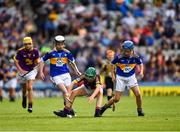 28 July 2019; Thomas O'Brien, Rathcormas NS, Rathcormac, Sligo, representing Tipperary, and James Cully, Kildalkey NS, Kildalkey, Meath, representing Wexford, and left, Harry Mac Canainn, Scoil na nÓg, Glanmire, Cork, representing Tipperary, during the INTO Cumann na mBunscol GAA Respect Exhibition Go Games at the GAA Hurling All-Ireland Senior Championship Semi Final match between Wexford and Tipperary at Croke Park in Dublin. Photo by Ray McManus/Sportsfile