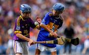 28 July 2019; Alfie Hughes, Annyalla NS, Castleblayney, Monaghan, representing Tipperary, in action against Matthew O'Neill, Carnaun NS, Athenry, Galway, representing Wexford,  during the INTO Cumann na mBunscol GAA Respect Exhibition Go Games at the GAA Hurling All-Ireland Senior Championship Semi Final match between Wexford and Tipperary at Croke Park in Dublin. Photo by Brendan Moran/Sportsfile