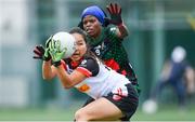 29 July 2019; Jiyeon Ko of Asia Cranes is tackled by Selaelo Charlotte Ragati of South Africa in their Ladies Football Native Born tournament game during the Renault GAA World Games 2019 Day 1 at WIT Arena, Carriganore, Co. Waterford. Photo by Piaras Ó Mídheach/Sportsfile
