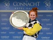 29 July 2019; Jockey Jody Townend celebrates with the trophy after winning the Connacht Hotel Handicap on Great White Shark during Day One of the Galway Races Summer Festival 2019 in Ballybrit, Galway. Photo by Seb Daly/Sportsfile