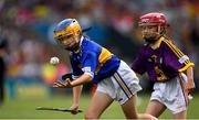 28 July 2019; Catríona McKinney, St Mura’s NS, Burnfoot, Donegal, representing Tipperary, in action against Saoirse D’Arcy, Scoil Mhuire na nGael , Dundalk, Louth, representing Wexford, during the INTO Cumann na mBunscol GAA Respect Exhibition Go Games at the GAA Hurling All-Ireland Senior Championship Semi Final match between Wexford and Tipperary at Croke Park in Dublin. Photo by Ramsey Cardy/Sportsfile