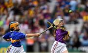 28 July 2019; Áine McDonald, St. Brigid’s Crossbridge, Arklow, Wicklow, representing Wexford, in action against Catríona McKinney, St Mura’s NS, Burnfoot, Donegal, representing Tipperary, during the INTO Cumann na mBunscol GAA Respect Exhibition Go Games at the GAA Hurling All-Ireland Senior Championship Semi Final match between Wexford and Tipperary at Croke Park in Dublin. Photo by Ramsey Cardy/Sportsfile