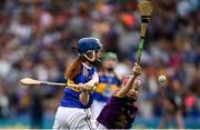 28 July 2019; Aoife Murphy, Clarecastle NS, Clarecastle, Clare, representing Tipperary, in action against Aoife Kirby, Scoil Tighearnach Naofa, Cullohill, Laois, representing Wexford, during the INTO Cumann na mBunscol GAA Respect Exhibition Go Games at the GAA Hurling All-Ireland Senior Championship Semi Final match between Wexford and Tipperary at Croke Park in Dublin. Photo by Ramsey Cardy/Sportsfile