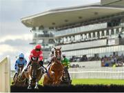 30 July 2019; Fast Buck, left, with Paul Townend up, jumps the fifth on their way to winning the Colm Quinn BMW Novice Hurdle on Day Two of the Galway Races Summer Festival 2019 in Ballybrit, Galway. Photo by Seb Daly/Sportsfile