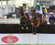 30 July 2019; Zero Ten, right, with David Mullins up, jumps the seventh, alongside Trump Sixteen, with Keith Donoghue up, on their way to winning the Latin Quarter Beginners Steeplechase on Day Two of the Galway Races Summer Festival 2019 in Ballybrit, Galway. Photo by Seb Daly/Sportsfile