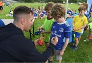 31 July 2019; Leinster player Rory O'Loughlin signs autographs for participants during the Bank of Ireland Leinster Rugby Summer Camp at Coolmine RFC in Castleknock, Dublin. Photo by Brendan Moran/Sportsfile