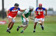 1 August 2019; Jack Doyle of London in action against Travis Gohsman, left, and Robert Messier of MidAtlantic in the Native Born Hurling Cup Semi-Final game during the Renault GAA World Games 2019 Day 4 at WIT Arena, Carriganore, Co. Waterford. Photo by Piaras Ó Mídheach/Sportsfile
