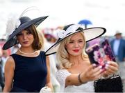 1 August 2019; Racegoers take a selfie prior to racing on Day Four of the Galway Races Summer Festival 2019 in Ballybrit, Galway. Photo by Seb Daly/Sportsfile