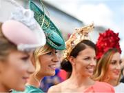 1 August 2019; Racegoers, from left, Sinead B Mullinery, from Rooskey, Leitrim, Eimear Reilly, from Cavan, Louise Dooner, from Kilglass, Roscommon, and Caitriona Moore, from Newtownforbes, Longford, pose for a photograph prior to racing on Day Four of the Galway Races Summer Festival 2019 in Ballybrit, Galway. Photo by Seb Daly/Sportsfile