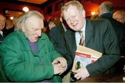 13 December 2005; Con Houlihan with publican Charlie Chawke at the launch of his latest book 'A Harvest',  in Mulligan's of Poolbeg Street, Dublin. Photo by Ray McManus/Sportsfile