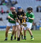 27 July 2019; Meabh Rouse, Gaelscoil an Eiscir Riada, Tullamore, Co Offaly, representing Kilkenny, is tackled by Bethan Storin, Ahalin NS, Ballingarry, Limerick, and Maeve O’Donnell, Millquarter PS, Toomebridge, Antrim, representing Limerick, during the INTO Cumann na mBunscol GAA Respect Exhibition Go Games at the GAA Hurling All-Ireland Senior Championship Semi-Final match between Limerick and Kilkenny at Croke Park in Dublin. Photo by Ray McManus/Sportsfile