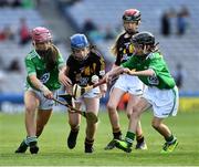 27 July 2019; Meabh Rouse, Gaelscoil an Eiscir Riada, Tullamore, Co Offaly, representing Kilkenny, is tackled by Bethan Storin, Ahalin NS, Ballingarry, Limerick, and Maeve O’Donnell, Millquarter PS, Toomebridge, Antrim, representing Limerick, during the INTO Cumann na mBunscol GAA Respect Exhibition Go Games at the GAA Hurling All-Ireland Senior Championship Semi-Final match between Limerick and Kilkenny at Croke Park in Dublin. Photo by Ray McManus/Sportsfile