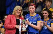 3 August 2019; Muireann Claffey of Longford is presented with the cup by Marua Hickey, Uachtarán, Ladies Gaelic Football Association, after the All-Ireland Ladies Football Minor B Final match between Longford and Roscommon at Duggan Park in Ballinasloe, Galway. Photo by Ray McManus/Sportsfile